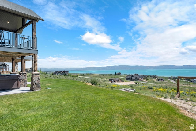 68 Hawksbeard Cir, Fish Haven, ID 83287 - view of green lawn with a deck with water view