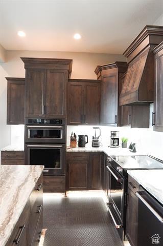 68 Hawksbeard Cir, Fish Haven, ID 83287 - kitchen with electric range oven, dishwashing machine, dark brown cabinets, light stone counters, and recessed lighting