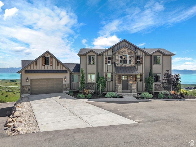 68 Hawksbeard Cir, Fish Haven, ID 83287 - view of front of house with stone siding, board and batten siding, concrete driveway, and a water view