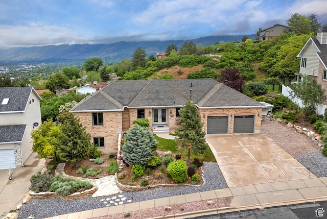 193 Coventry Ln, North Salt Lake, UT 84054 - ranch-style house with french doors, brick siding, an attached garage, a mountain view, and driveway