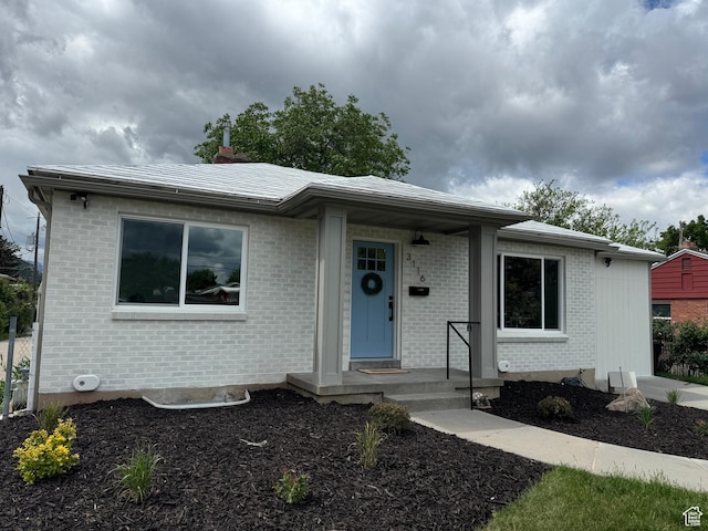view of front of property featuring brick siding