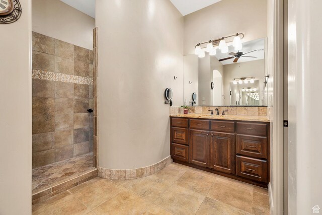 373 W Meridian Dr, Ivins, UT 84738 - bathroom featuring ceiling fan, vanity, and walk in shower