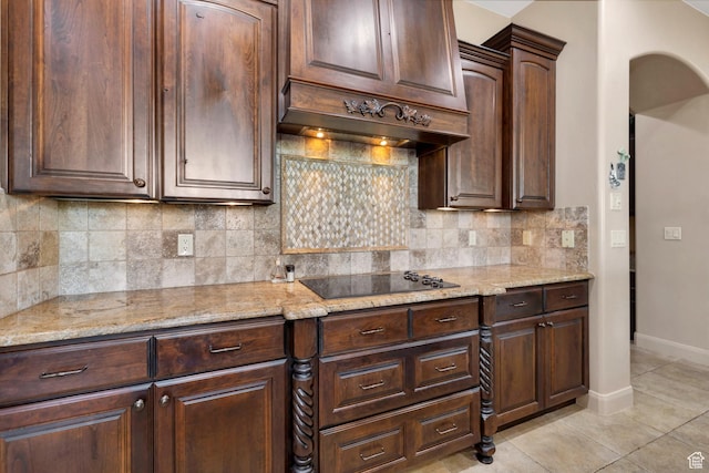 373 W Meridian Dr, Ivins, UT 84738 - kitchen featuring black electric cooktop, tasteful backsplash, light stone counters, and light tile patterned floors