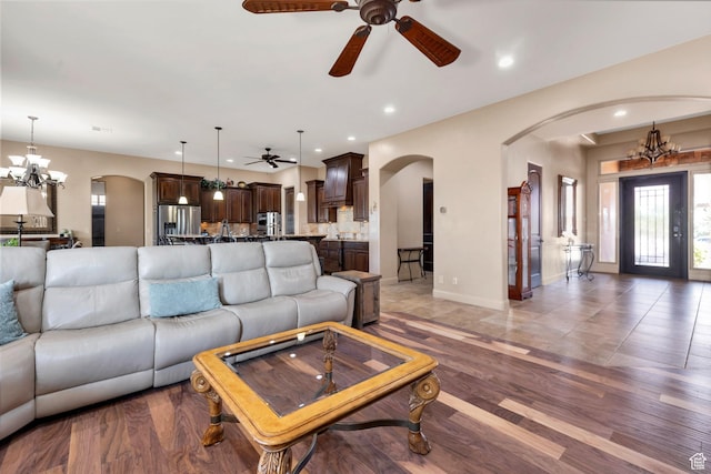 373 W Meridian Dr, Ivins, UT 84738 - living area with arched walkways, ceiling fan, a chandelier, and recessed lighting