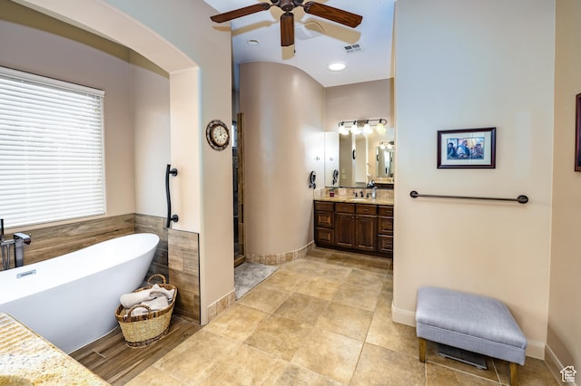 373 W Meridian Dr, Ivins, UT 84738 - bathroom with a ceiling fan, a soaking tub, vanity, a stall shower, and tile patterned floors