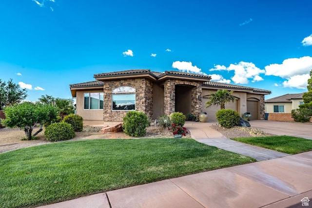 373 W Meridian Dr, Ivins, UT 84738 - mediterranean / spanish home featuring stucco siding, a tile roof, driveway, and a front yard