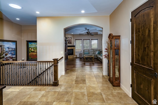 373 W Meridian Dr, Ivins, UT 84738 - corridor with arched walkways, recessed lighting, an upstairs landing, baseboards, and tile patterned floors