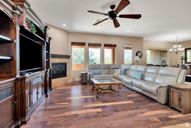 373 W Meridian Dr, Ivins, UT 84738 - living area featuring a ceiling fan, wood finished floors, a tiled fireplace, a chandelier, and recessed lighting