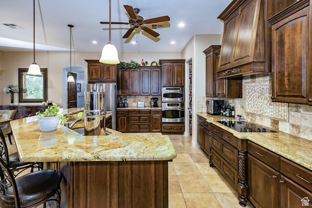 373 W Meridian Dr, Ivins, UT 84738 - kitchen featuring stainless steel appliances, a sink, custom exhaust hood, ceiling fan, and light stone countertops