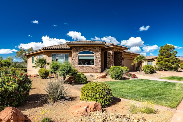 373 W Meridian Dr, Ivins, UT 84738 - mediterranean / spanish-style house with stone siding, a tiled roof, a garage, and stucco siding