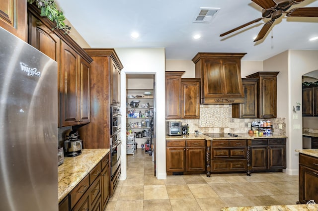 373 W Meridian Dr, Ivins, UT 84738 - kitchen with stainless steel appliances, ceiling fan, decorative backsplash, light stone counters, and premium range hood
