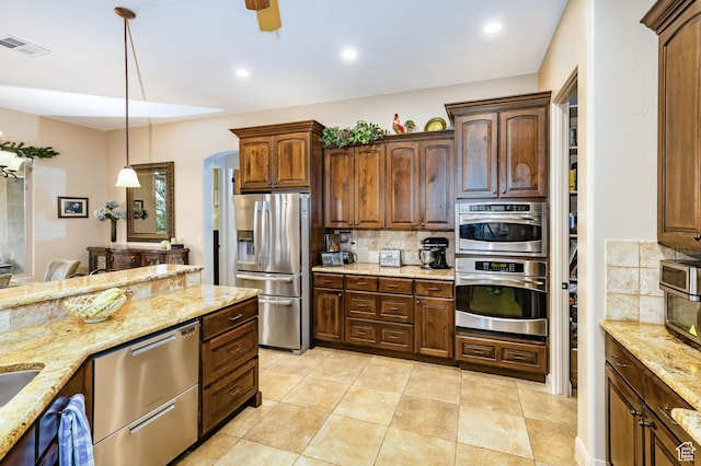 373 W Meridian Dr, Ivins, UT 84738 - kitchen featuring stainless steel appliances, backsplash, pendant lighting, a ceiling fan, and recessed lighting