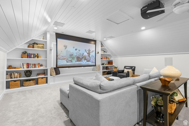 carpeted home theater room featuring built in shelves, wooden ceiling, and vaulted ceiling