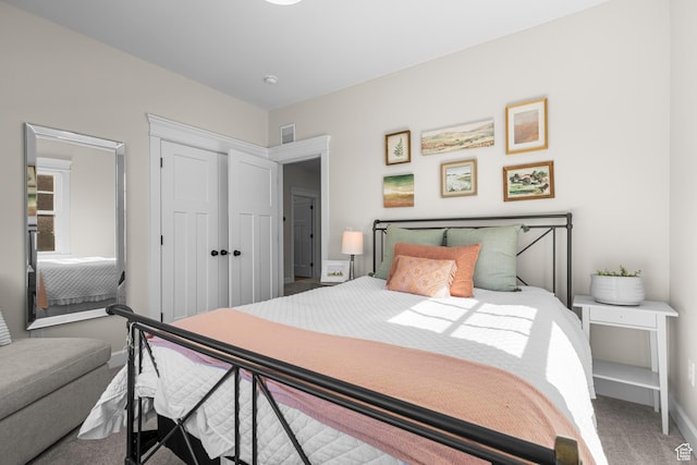 bedroom featuring carpet floors, a closet, and baseboards