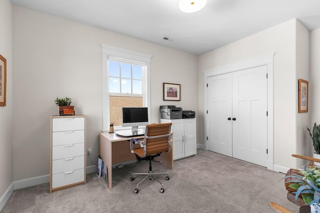 office space with light colored carpet and baseboards