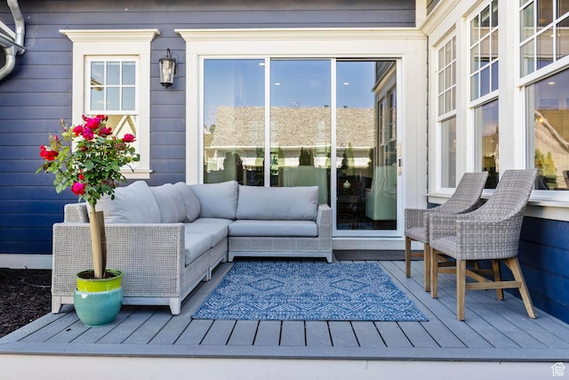 wooden terrace featuring outdoor lounge area