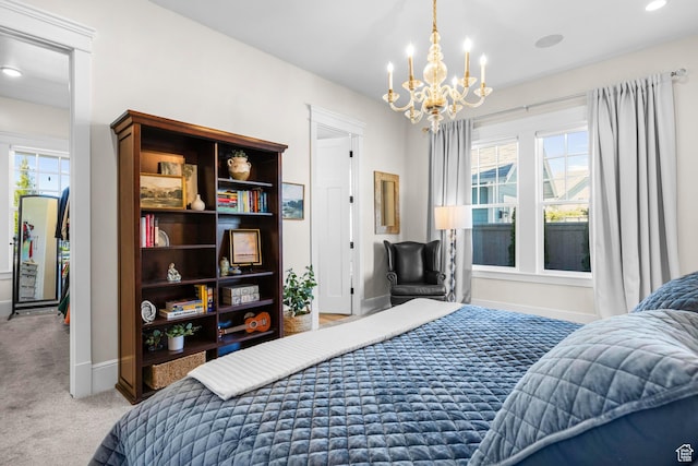 carpeted bedroom with a chandelier, multiple windows, baseboards, and recessed lighting