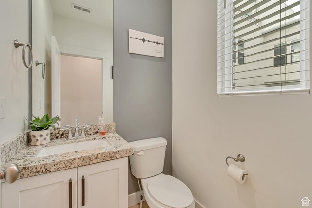 11233 S Clear Blue Dr Unit 402, South Jordan, UT 84009 - half bath featuring toilet, vanity, and baseboards