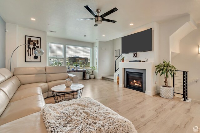11233 S Clear Blue Dr Unit 402, South Jordan, UT 84009 - living area with ceiling fan, wood finished floors, baseboards, recessed lighting, and a glass covered fireplace