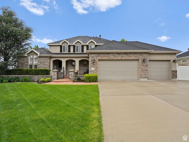 view of front facade featuring stucco siding, concrete driveway, a garage, and a porch