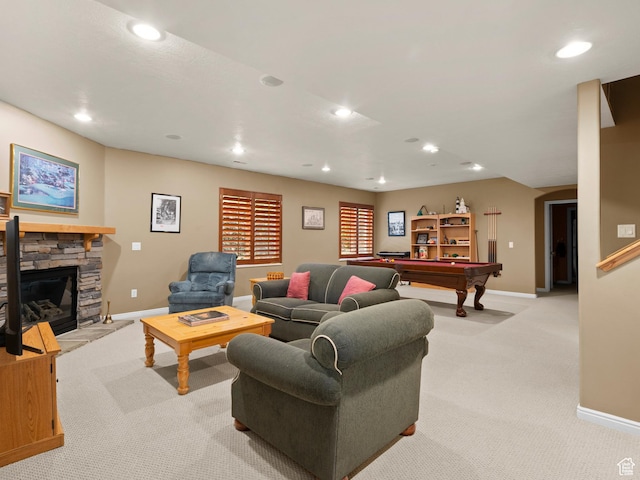 living room with light carpet, recessed lighting, baseboards, billiards table, and a stone fireplace