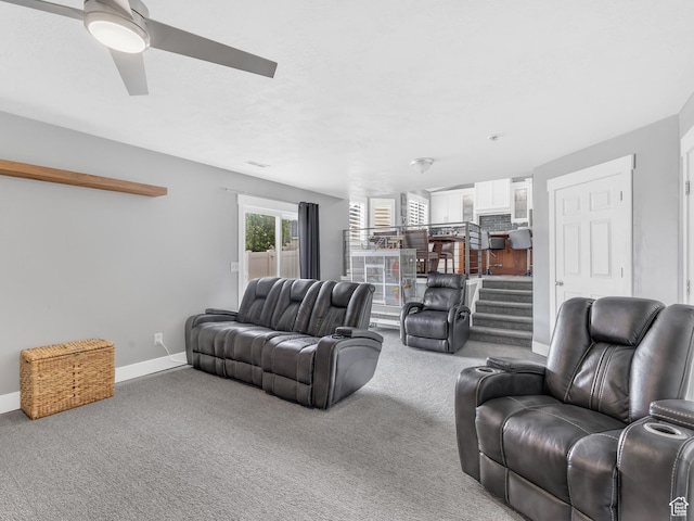 156 Crystal Bay Dr, Stansbury Park, UT 84074 - carpeted living room with baseboards and ceiling fan