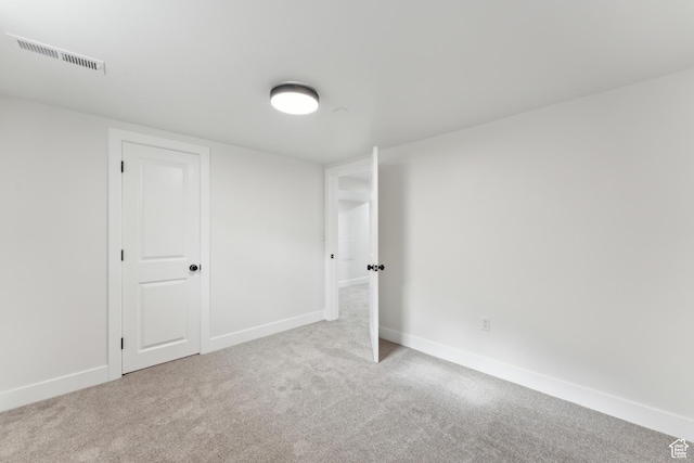 unfurnished bedroom with carpet floors and baseboards