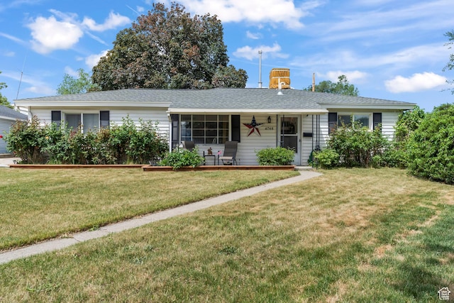 ranch-style house with a front lawn and covered porch