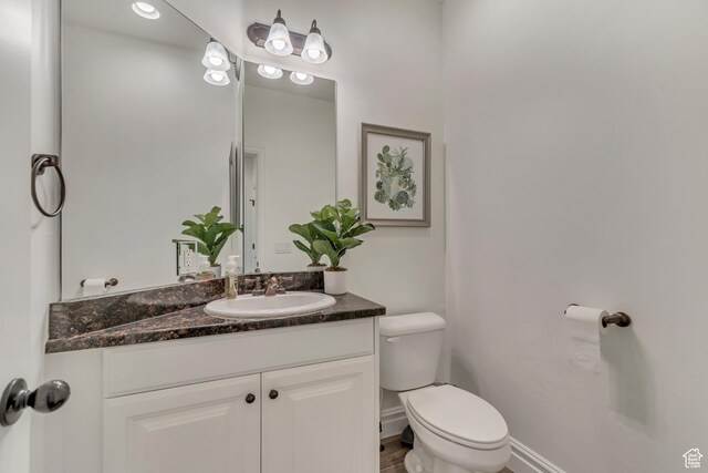 half bath with toilet and vanity