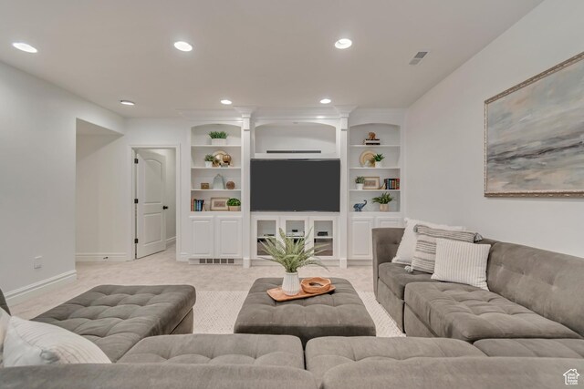 living area with light colored carpet, recessed lighting, and baseboards