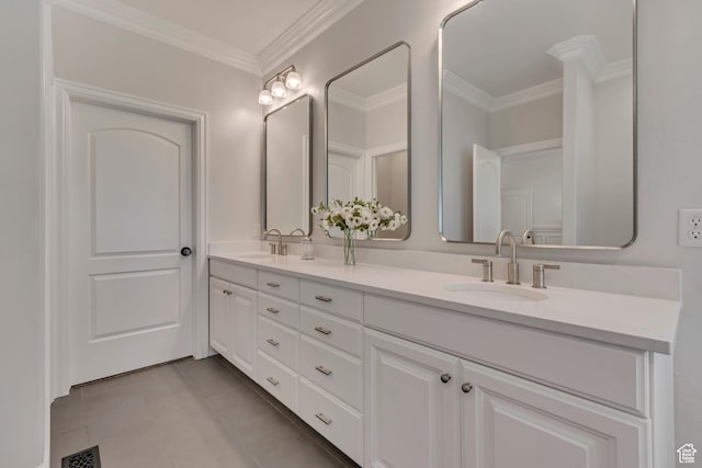 bathroom featuring crown molding, double vanity, and tile patterned floors