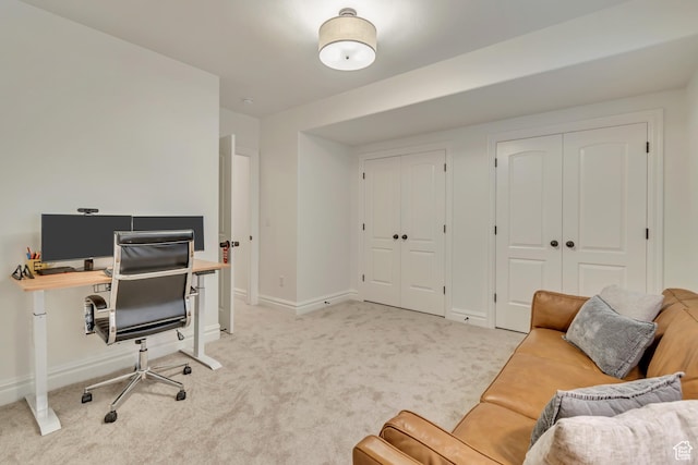 office with light colored carpet and baseboards