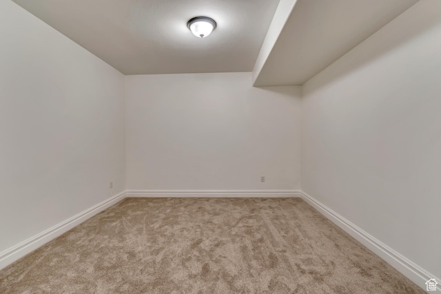 spare room with carpet flooring and baseboards