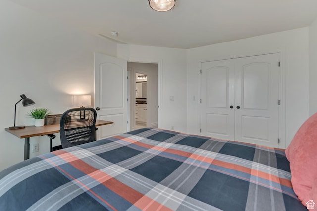 bedroom with an office area and a closet
