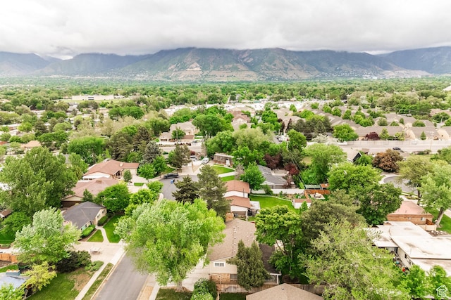 1256 E Darby Cir S, Murray, UT 84117 - aerial view of residential area featuring a mountainous background