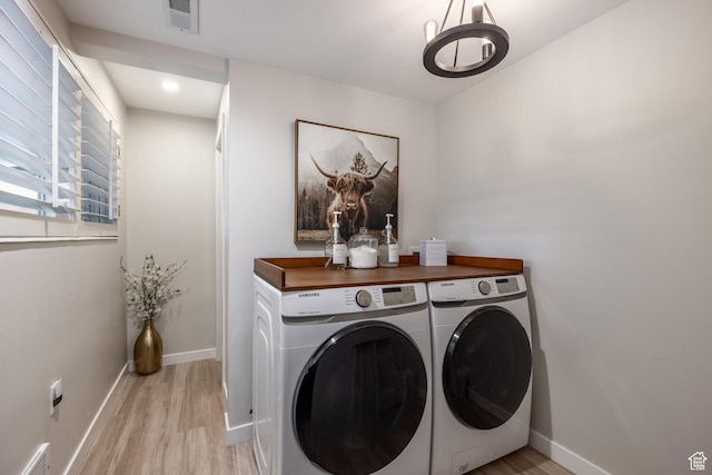 1256 E Darby Cir S, Murray, UT 84117 - laundry room featuring independent washer and dryer, light wood finished floors, baseboards, a chandelier, and recessed lighting