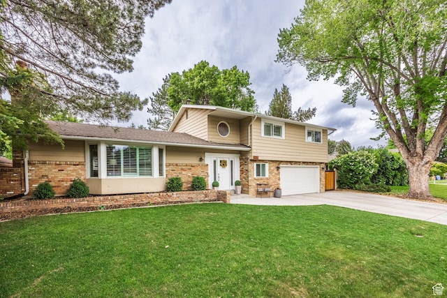 1256 E Darby Cir S, Murray, UT 84117 - view of front of home with brick siding, driveway, an attached garage, and a front yard