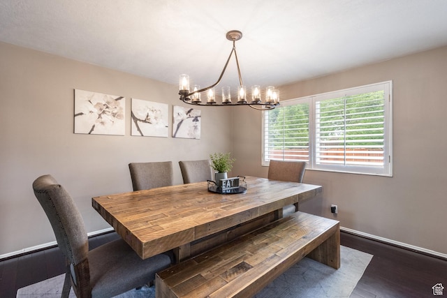1256 E Darby Cir S, Murray, UT 84117 - dining area with a chandelier, wood finished floors, and baseboards