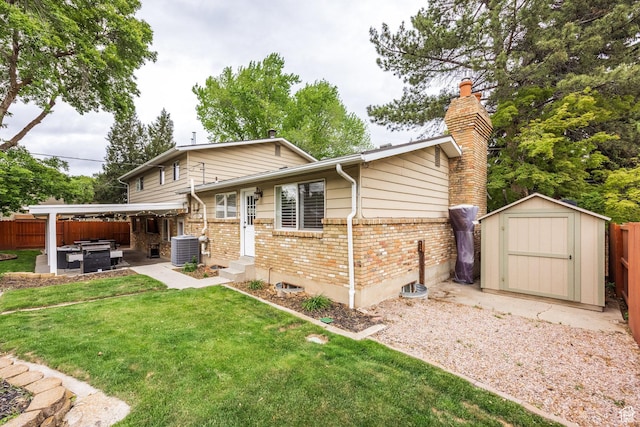 1256 E Darby Cir S, Murray, UT 84117 - back of house with brick siding, a patio, a storage shed, a chimney, and a hot tub