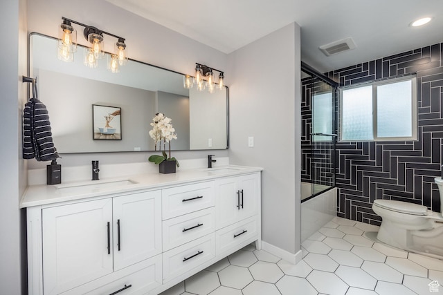 1256 E Darby Cir S, Murray, UT 84117 - bathroom featuring toilet, tile patterned flooring, double vanity, recessed lighting, and baseboards