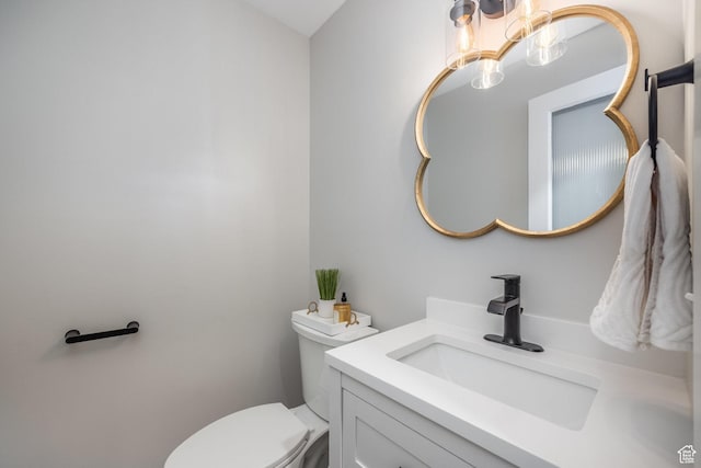 1256 E Darby Cir S, Murray, UT 84117 - half bathroom with a chandelier, vanity, and toilet