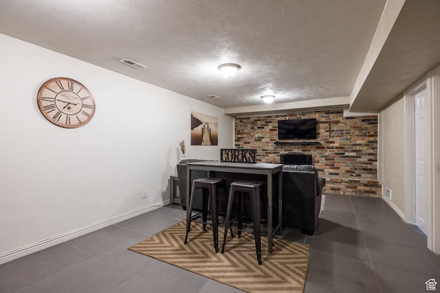 1256 E Darby Cir S, Murray, UT 84117 - bar with a textured ceiling, tile patterned floors, baseboards, a fireplace, and brick wall
