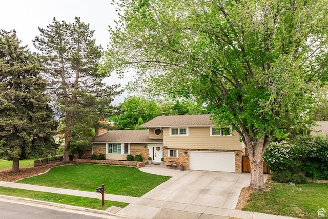 1256 E Darby Cir S, Murray, UT 84117 - split level home featuring driveway, brick siding, an attached garage, and a chimney