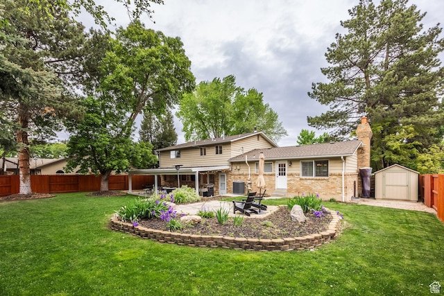 1256 E Darby Cir S, Murray, UT 84117 - rear view of house with a storage unit, a chimney, brick siding, a patio, and an outbuilding