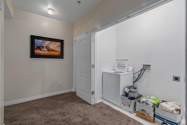 hallway with carpet flooring and baseboards