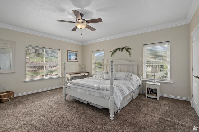carpeted bedroom with crown molding, multiple windows, baseboards, and ceiling fan