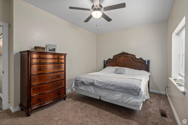 bedroom with carpet, baseboards, and a ceiling fan