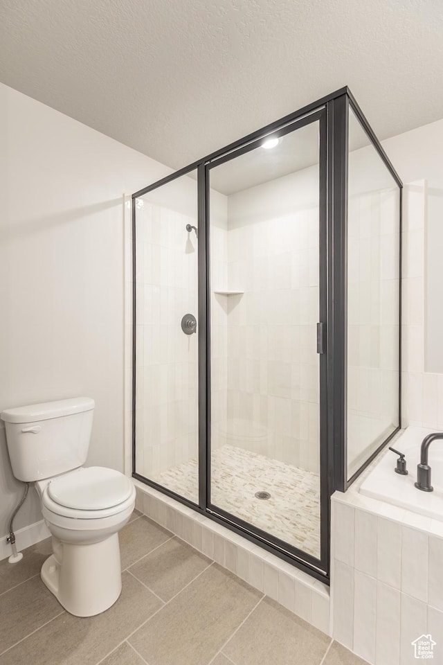 709 S 3575 W Unit 147, West Weber, UT 84401 - full bath featuring a bath, a shower stall, and tile patterned floors