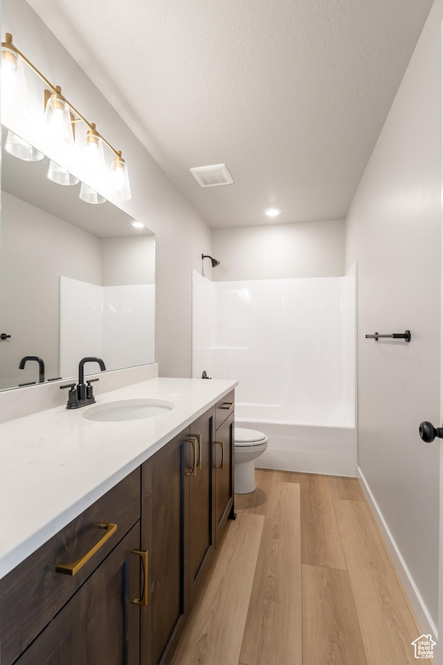 709 S 3575 W Unit 147, West Weber, UT 84401 - full bathroom with wood finished floors, vanity, tub / shower combination, and recessed lighting