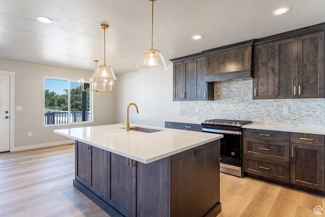 709 S 3575 W Unit 147, West Weber, UT 84401 - kitchen with stainless steel range, light wood-style flooring, backsplash, a textured ceiling, and recessed lighting